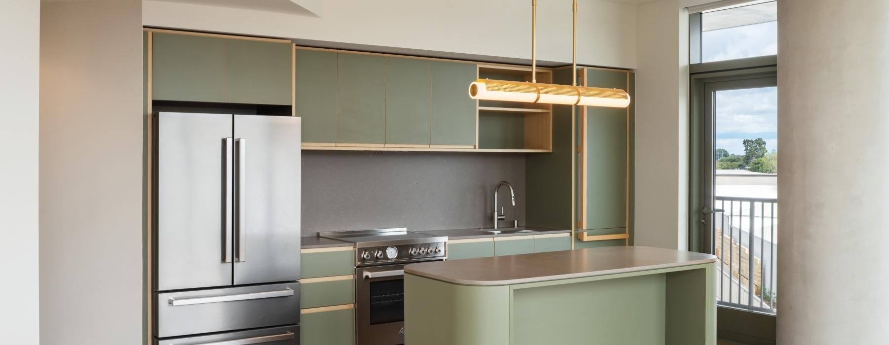 a kitchen with a bar and refrigerator