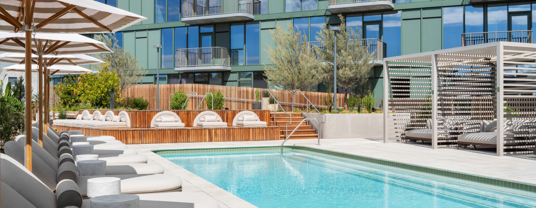 Outdoor pool lounge with cabanas
