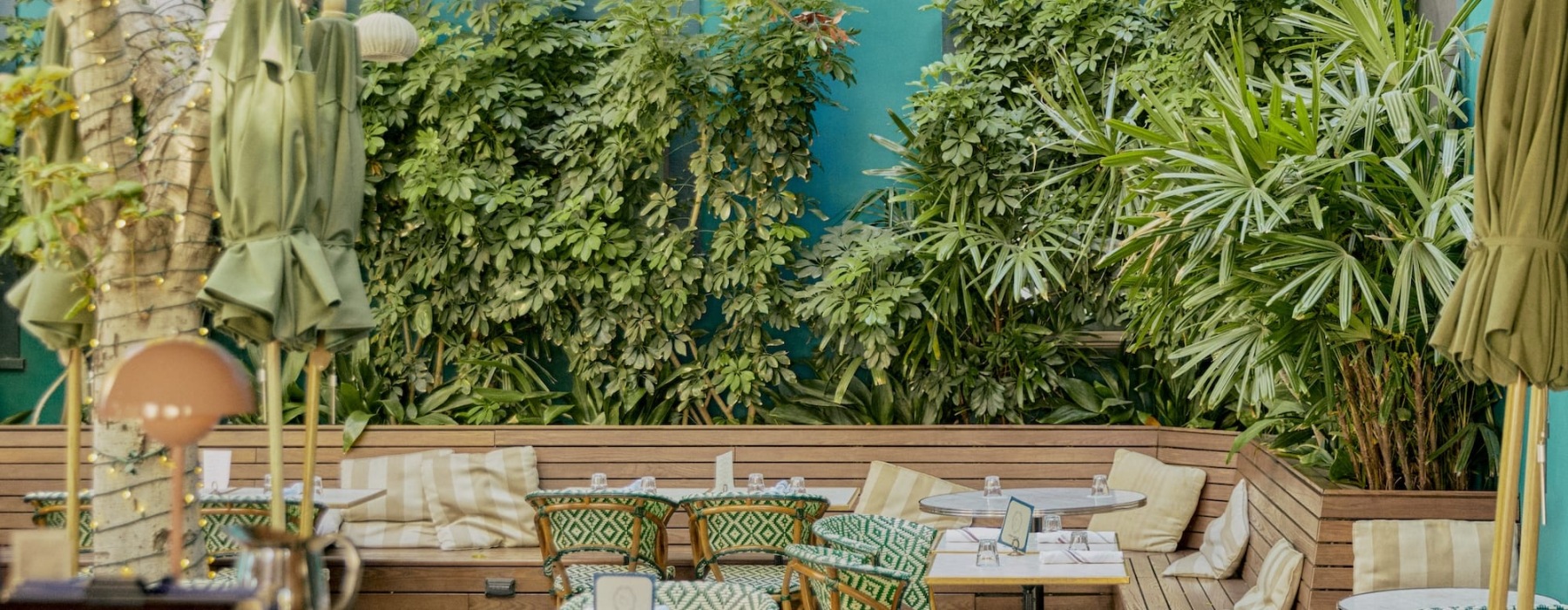 a patio with tables and chairs